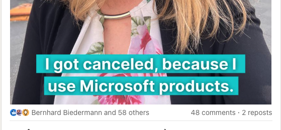Ausschnitt eines Meme-artigen Bildes, das im Hintergrund das Profilfoto einer Person mit blondem, langem Haar zeigt und die Beschriftung "I got cancelled because I use Microsoft products."

